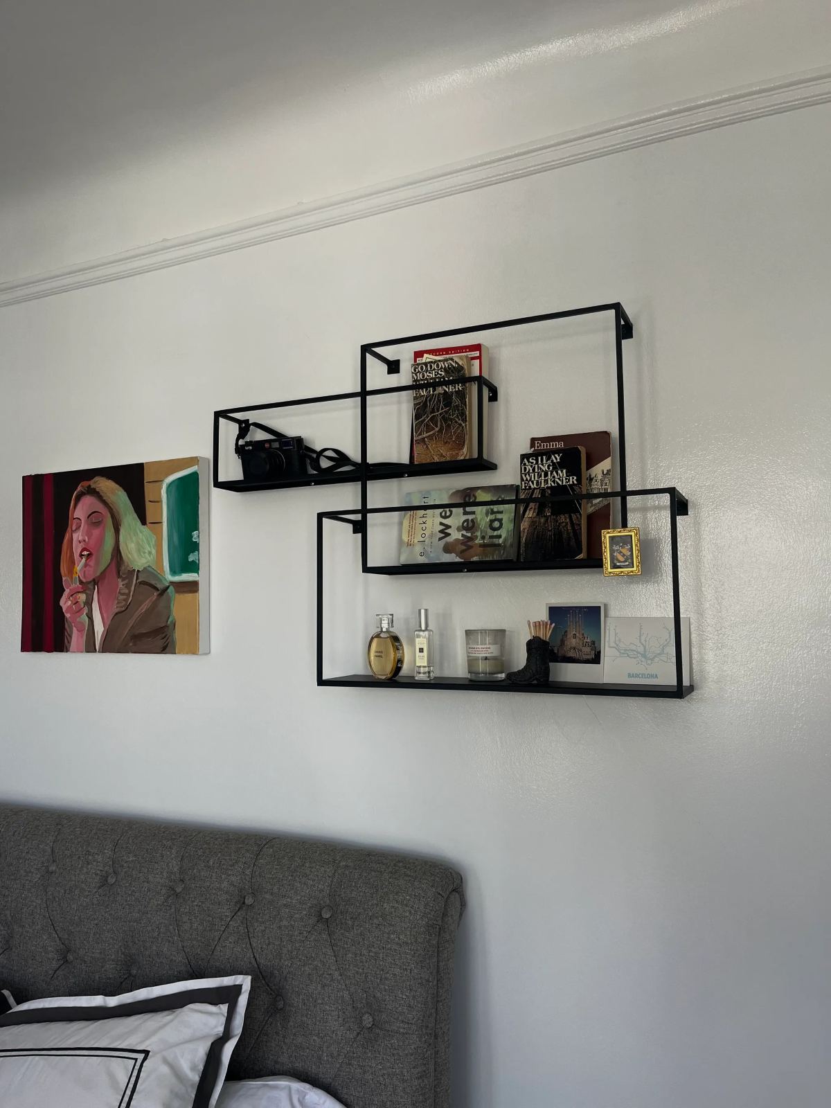 Modern geometric wall shelves holding books and decor