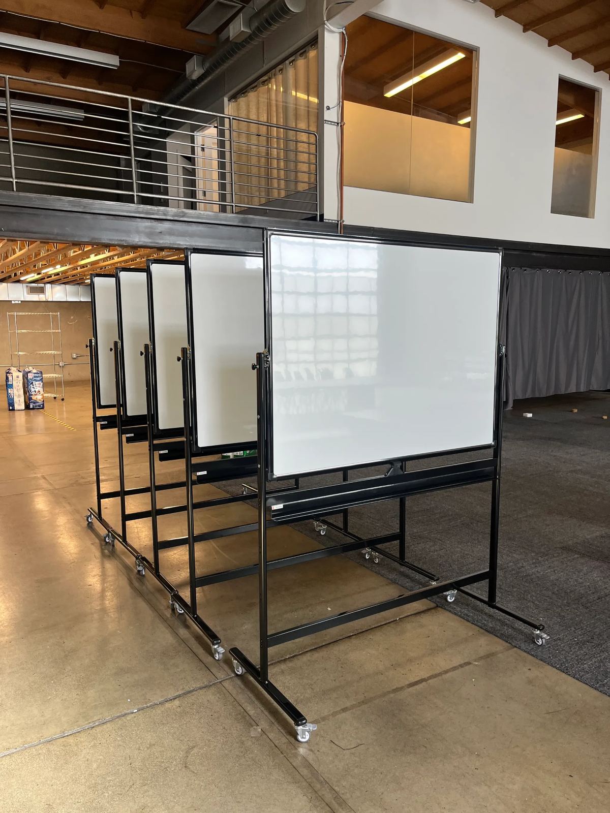 Mobile whiteboards and office furniture assembled for a workplace
